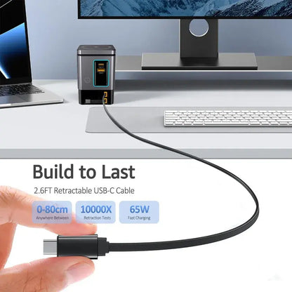 Black desktop charging dock with retractable USB-C cable extended from front panel