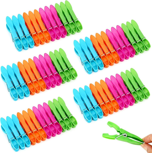 Assorted plastic clothespins in bright colors, spring clips for hanging laundry