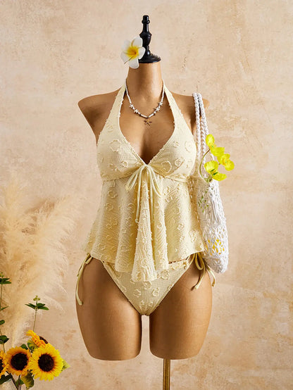 Light yellow textured halter peplum tie-front bikini set with high-leg bottoms on mannequin