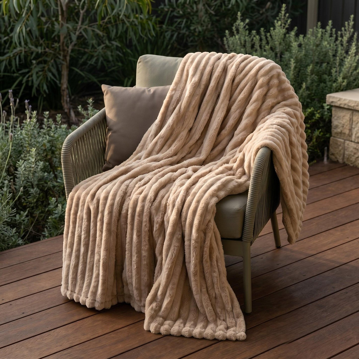 Light coffee ribbed flannel throw blanket draped over outdoor chair