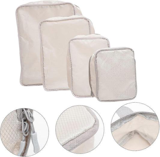 Cream polyester compression packing cubes set, four zippered cubes with mesh texture