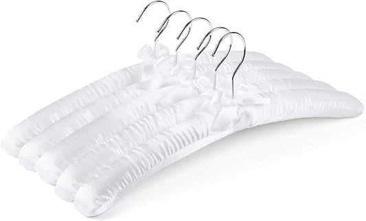 Set of white satin padded clothing hangers with chrome metal hooks and curved shoulders