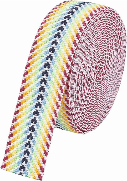 Arrow-pattern striped ribbon roll in rainbow pastel colors with navy zigzags