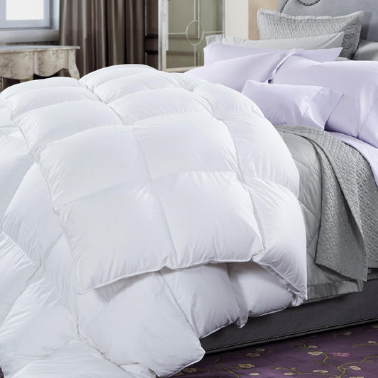 White down quilt with stitched baffles and matching pillows on a bed