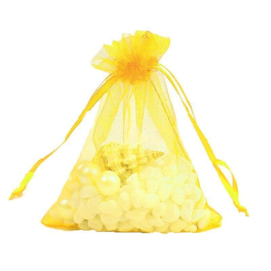 Yellow sheer organza drawstring pouch filled with white pebbles