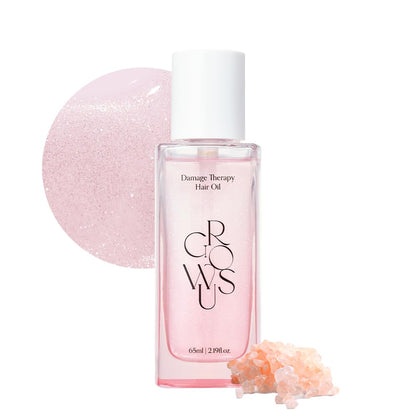 Hair oil bottle with white cap, clear pink liquid inside for damage therapy
