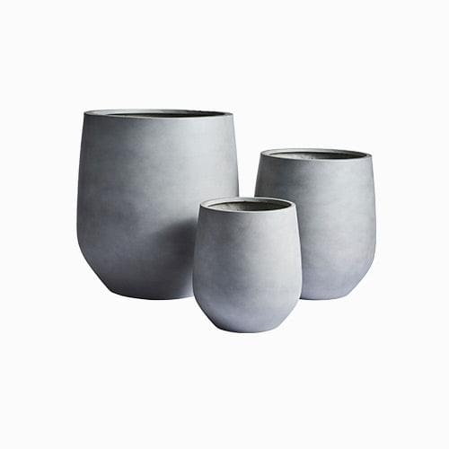 Three cylindrical planters, matte light gray, varying sizes