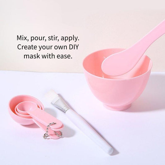 Pink facial mask mixing bowl with applicator spoon, plus brush and small scoops