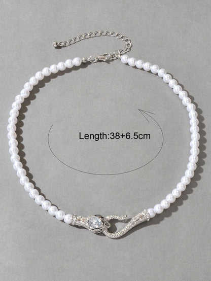 Pearl bead necklace with silver-toned snake centerpiece and chain extender for adjustable length