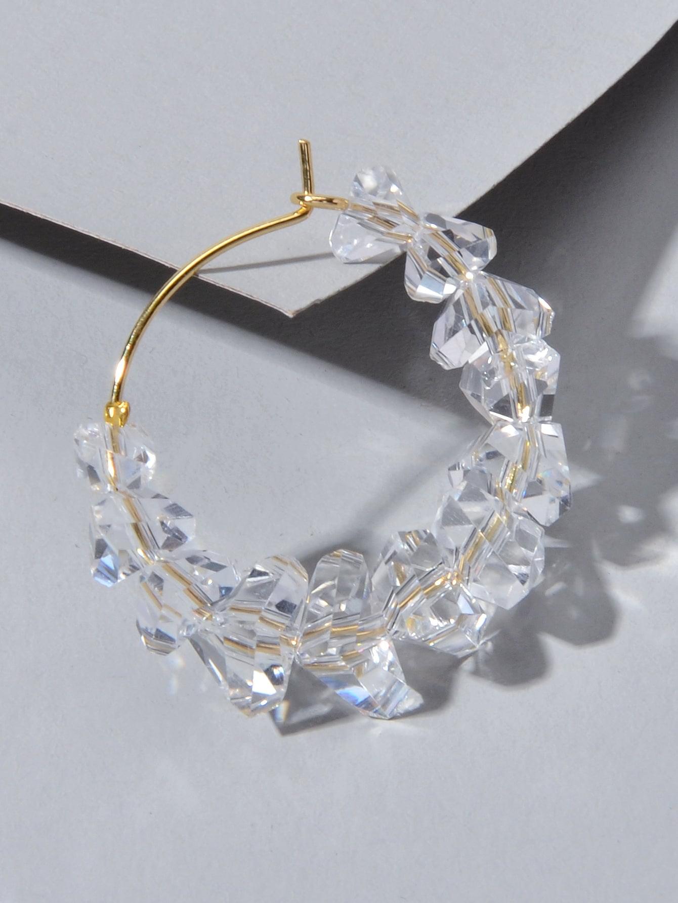 Gold-tone hoop dangle earrings with clear transparent acrylic bead chain
