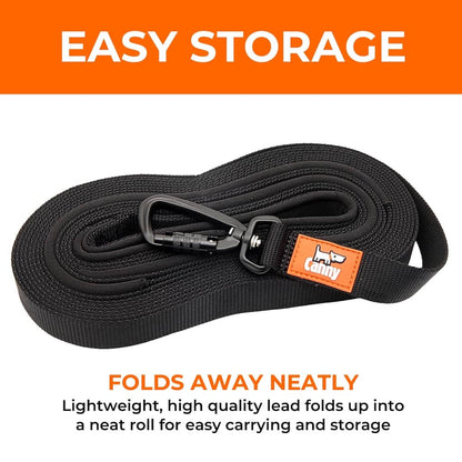 Black dog recall lead folded neatly with metal clip and orange brand tag on handle