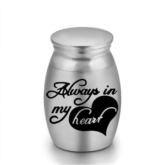 Steel pet heart urn keepsake with “Always in My Heart” heart graphic on front