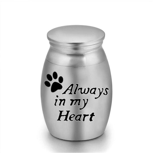 Steel pet urn keepsake with paw print and “Always in my Heart” engraving
