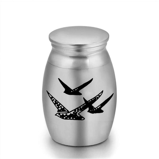 Metal mini keepsake urn with flying bird engraving and screw-top lid