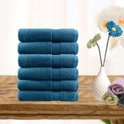Set of ultra-light cotton face washers, teal, folded stack.