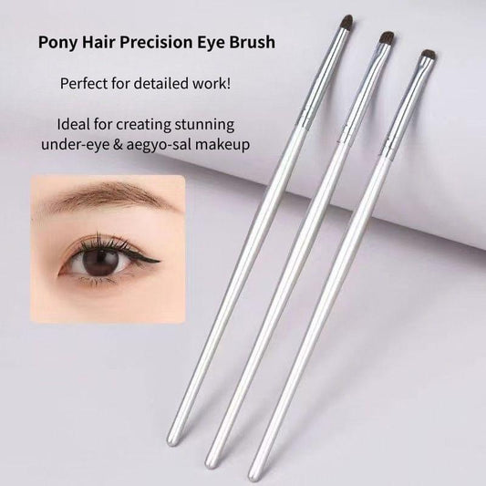 3 precision eye brushes with metallic silver handles and compact dark bristle heads