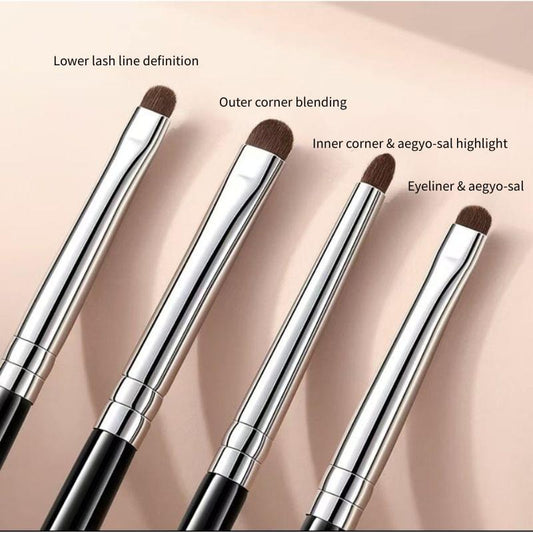 Four horse-hair style eye brushes with brown bristles on black handles and silver ferrules