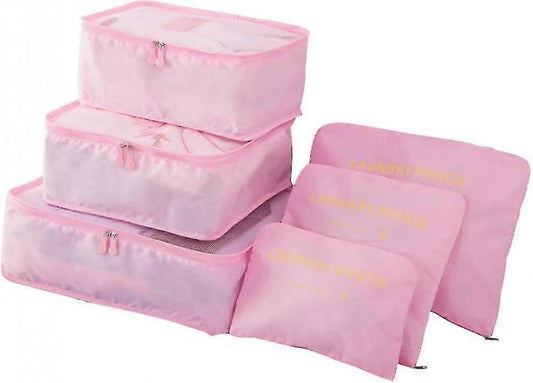Pink packing cubes set with zip closures, stacked for travel storage.