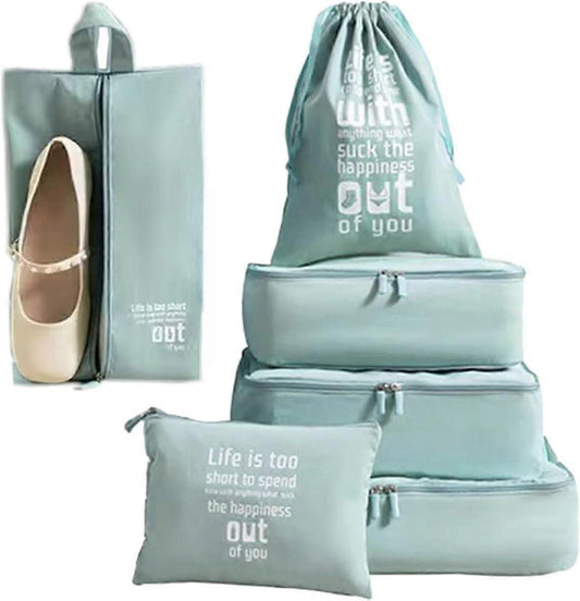 Blue packing cubes set with drawstring laundry bag and zipper compartments, stacked