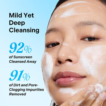 Cleansing foam lather on face during use, showing bubbles and gentle wash effect