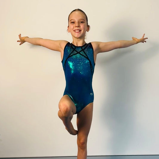 Teal blue kids gymnastics one-piece leotard with sparkly pattern and crisscross front