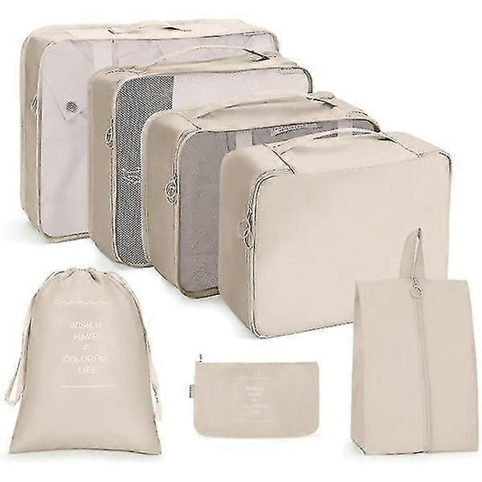 Travel packing cube set with beige zippered pouches and folded organizers