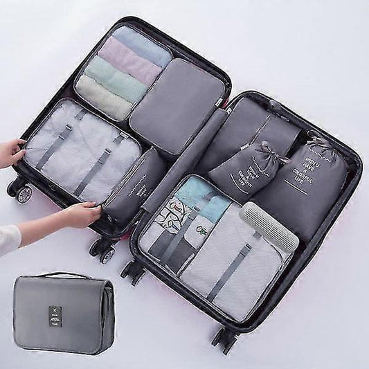 Black travel packing cube set open with multiple zip compartments and side pouch
