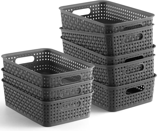 Grey woven plastic storage baskets set with cutout handles and woven sides