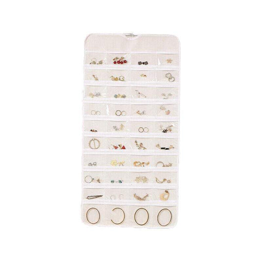 Hanging jewelry organizer pouch with clear pocket rows for earrings and rings, white/cream