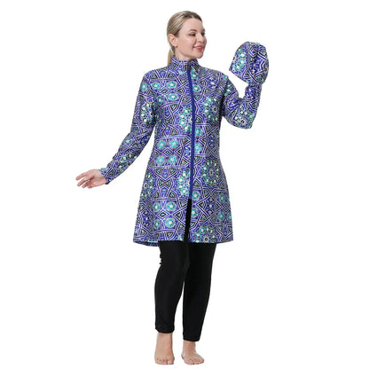Side view: women’s hooded zip swim tunic in blue geometric print with black leggings.