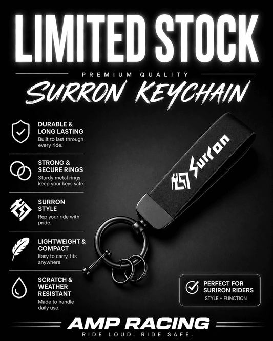 Surron keychain with metal key ring and black logo tag