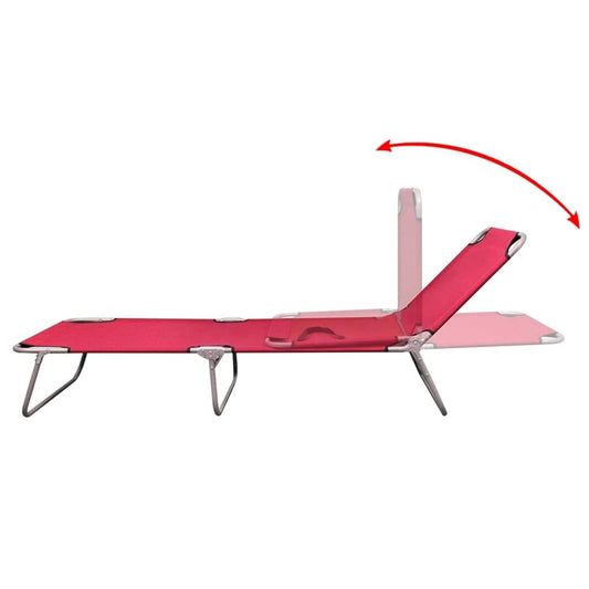 Red folding sun lounger fully extended with adjustable backrest and legs
