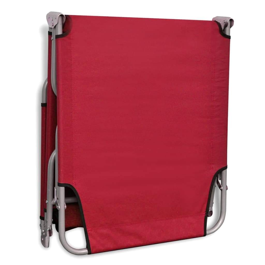 Red folding sun lounger in upright position with side frame and handle