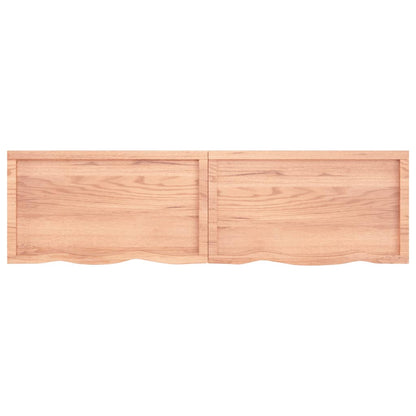 Light brown oak wall shelf with two front panels and raised lip