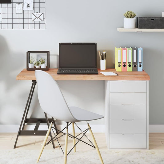 Light brown oak table top on a home office desk with laptop, books, and organizer