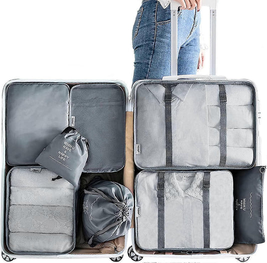 Gray fabric packing cubes set of 8 with zipper and compression straps, packed open