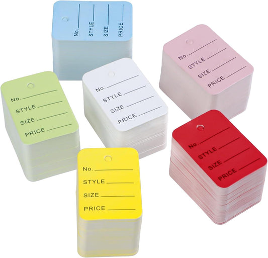 Stack of unstrung colored clothing price tags with blank lines for style, size, and price