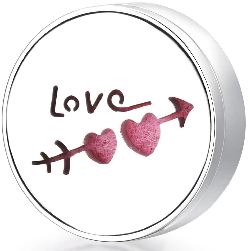 Round wearable diffuser locket with pink heart shapes and Love motif on felt insert