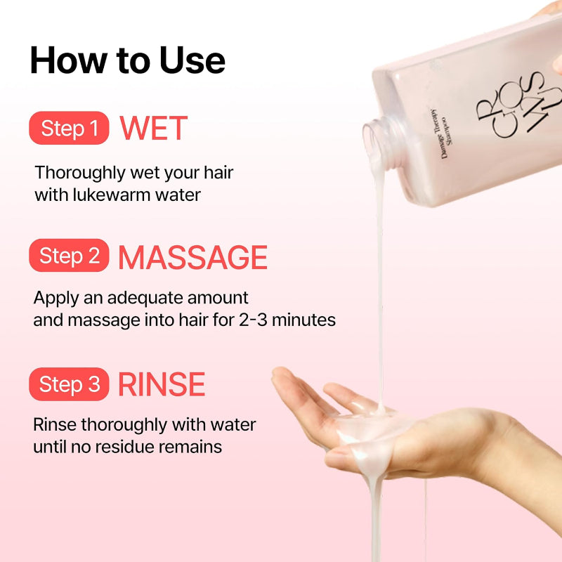 Pink shampoo bottle with white pump pouring product, hands shown