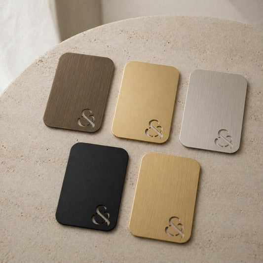 Set of metal color swatch cards in antique brass, gold, nickel, and black tones