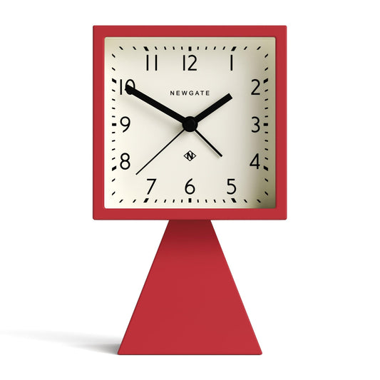 Fire engine red alarm clock with square face, black hands, red pedestal base