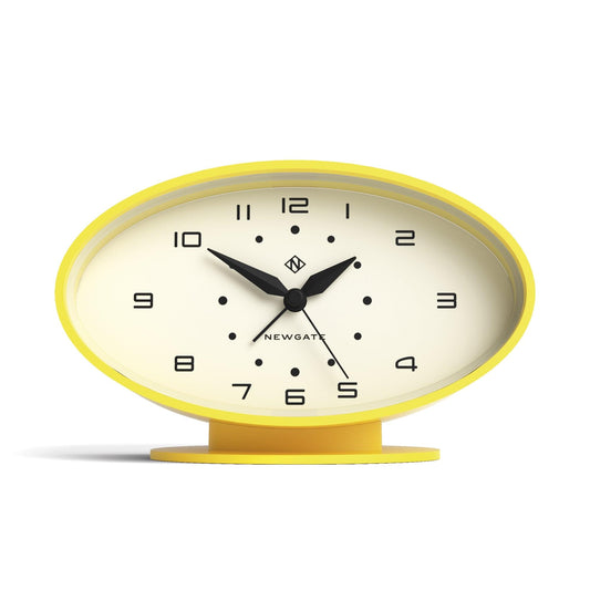 Yellow oval alarm clock with white dial and black hands.