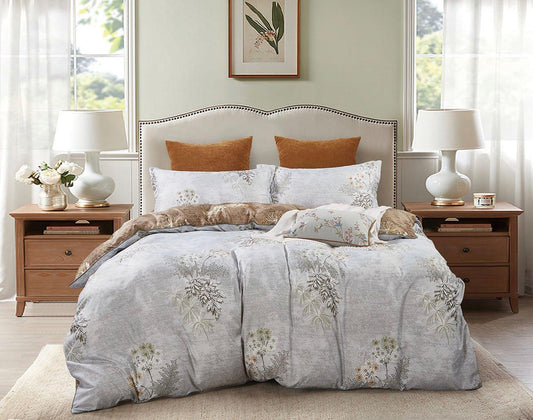 Super king quilt and duvet cover set with light blue floral print, orange accent pillows