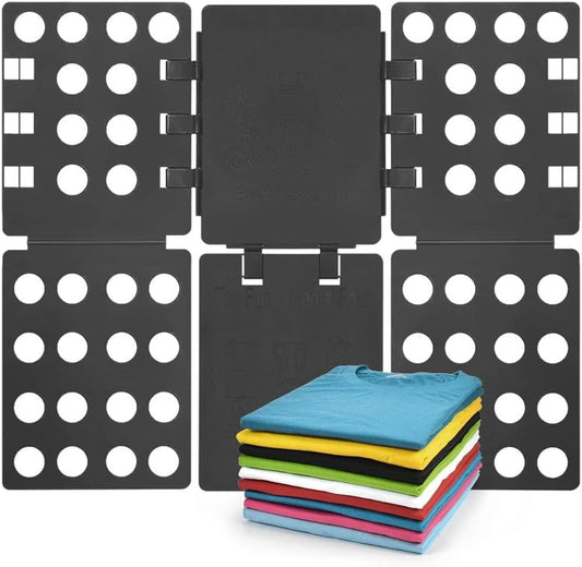 Black adjustable folding board with dotted side panels, holding folded clothes stack