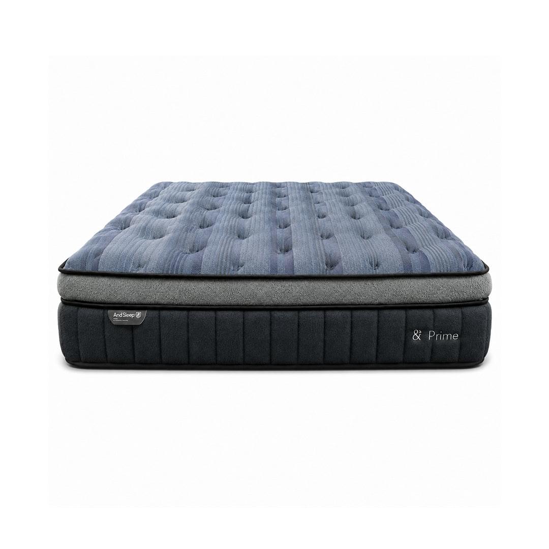Blue quilted mattress with dark side panels and & Prime branding on base