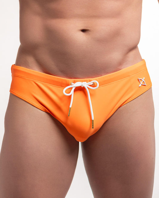 Orange swim brief with white drawstring ties and small X logo