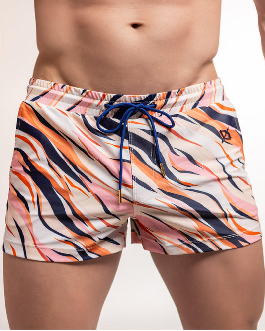 Tiger-print swim shorts in pink, navy, and orange with blue drawstring waistband
