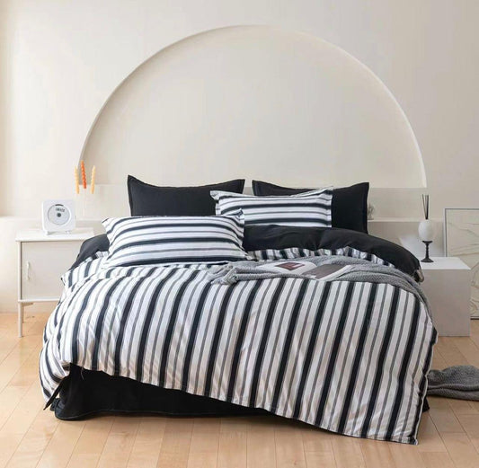 King quilt cover set with navy and white vertical stripes and black pillowcases