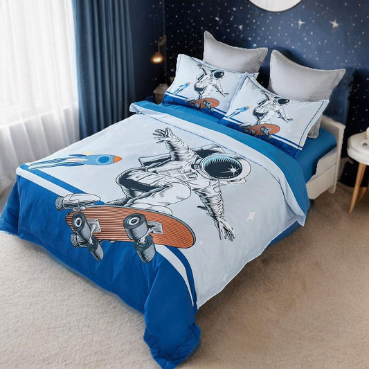 Kids astronaut quilt cover set with two pillowcases, blue bottom and skateboard graphic
