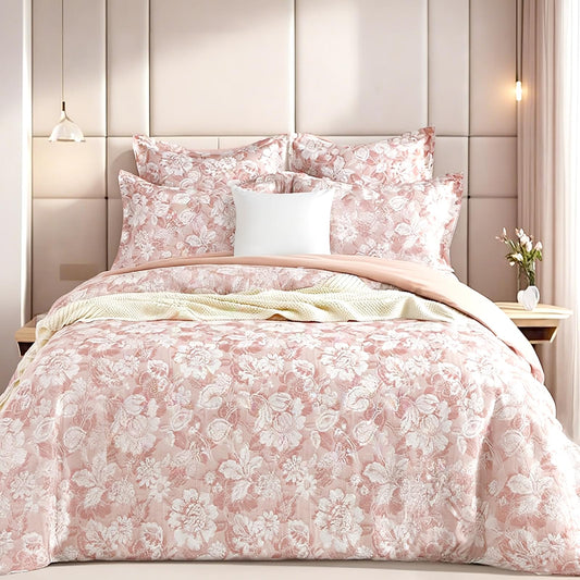 Blush pink floral jacquard quilt cover set with matching pillowcases and two shams